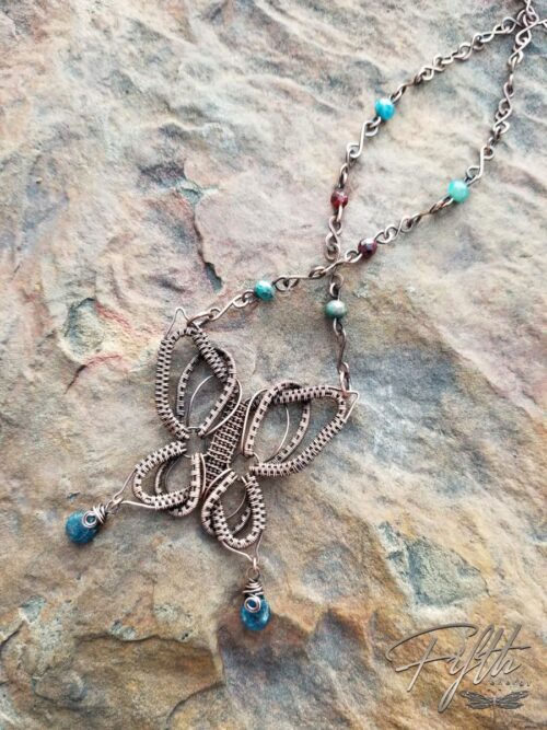 Copper butterfly necklace with apatite and garnet gemstones fifth energy jewelry