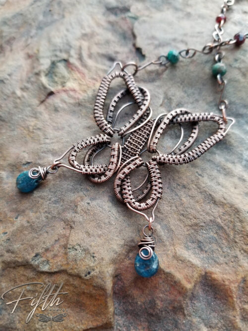 Copper butterfly necklace with apatite and garnet gemstones fifth energy jewelry