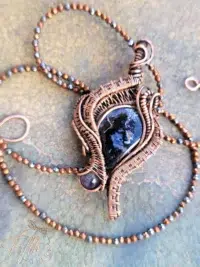 Arfvedsonite and Iolite Necklace wrapped in copper. Fifth Energy Jewelry
