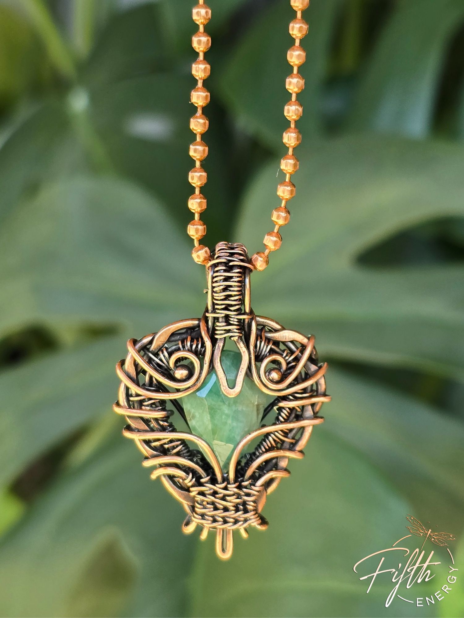 Copper Encased Emerald Necklace 6 Unique emerald necklace crafted in the USA with high-quality American-made copper. The handmade wire-wrapped setting frames the deep green emerald, creating a statement pendant for nature-inspired jewelry lovers.