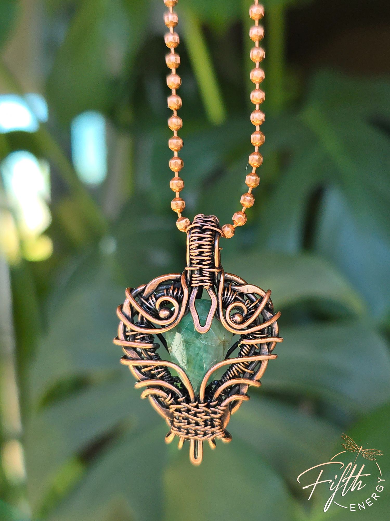 Copper Encased Emerald Necklace 7 One-of-a-kind copper and emerald necklace handcrafted in the United States. The natural emerald is encased in durable American-made copper, showcasing artisan craftsmanship and earthy elegance.