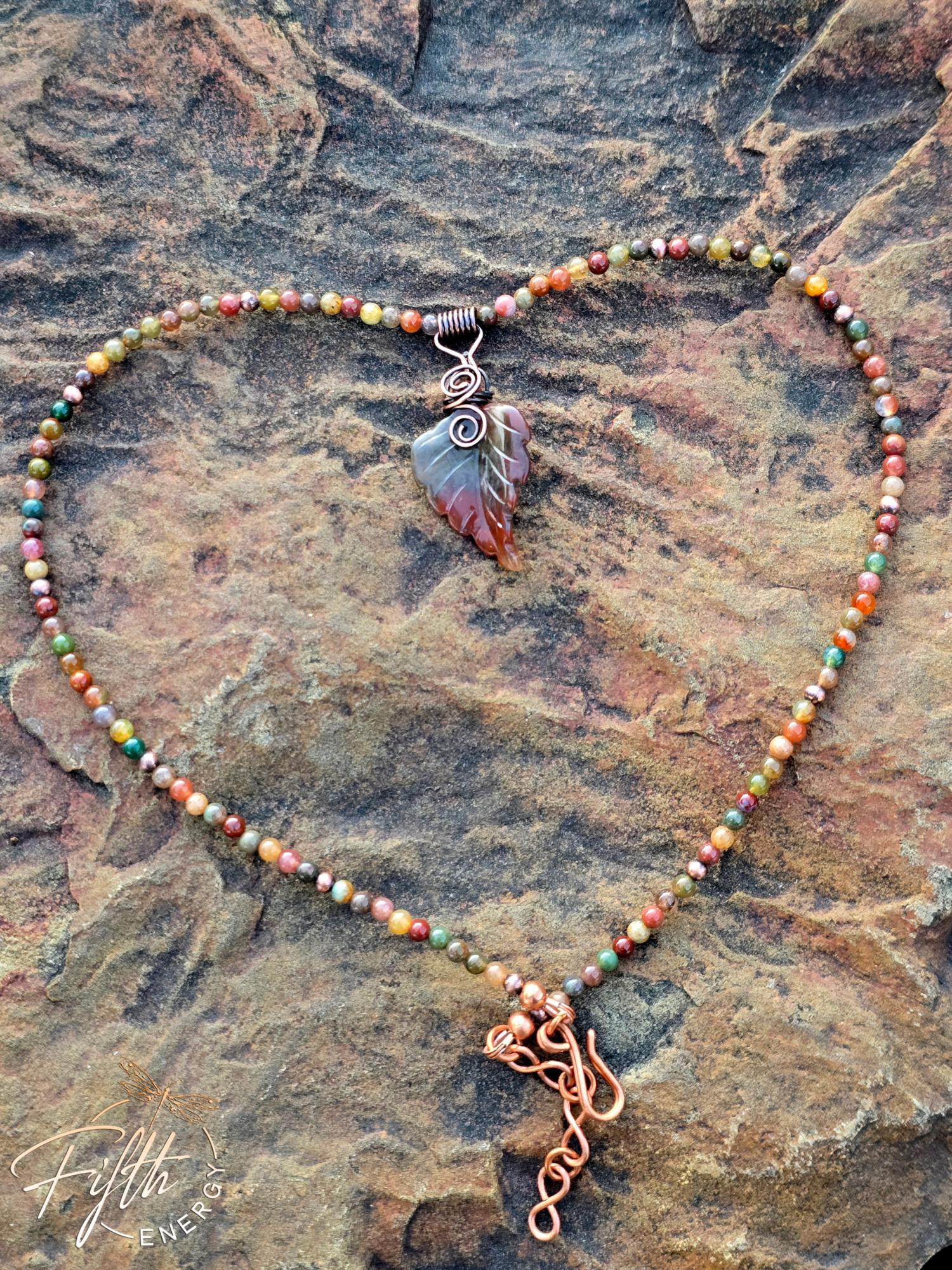 Warm Indian Agate Carved Leaf Necklace 3 One-of-a-kind Warm Indian Agate Carved Leaf Necklace featuring a hand-carved agate leaf pendant and pure copper bail on a beaded agate cord.