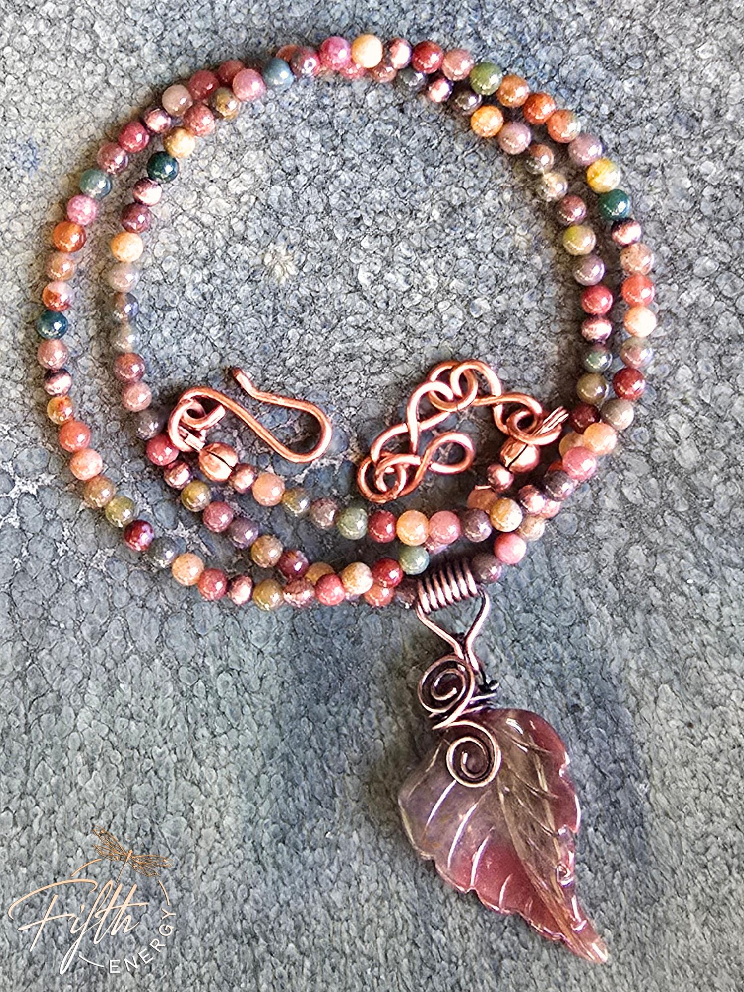 Warm Indian Agate Carved Leaf Necklace 9 Artisan-crafted Indian Agate leaf necklace with warm-toned gemstone beads and a hand-formed copper bail, perfect for nature lovers.
