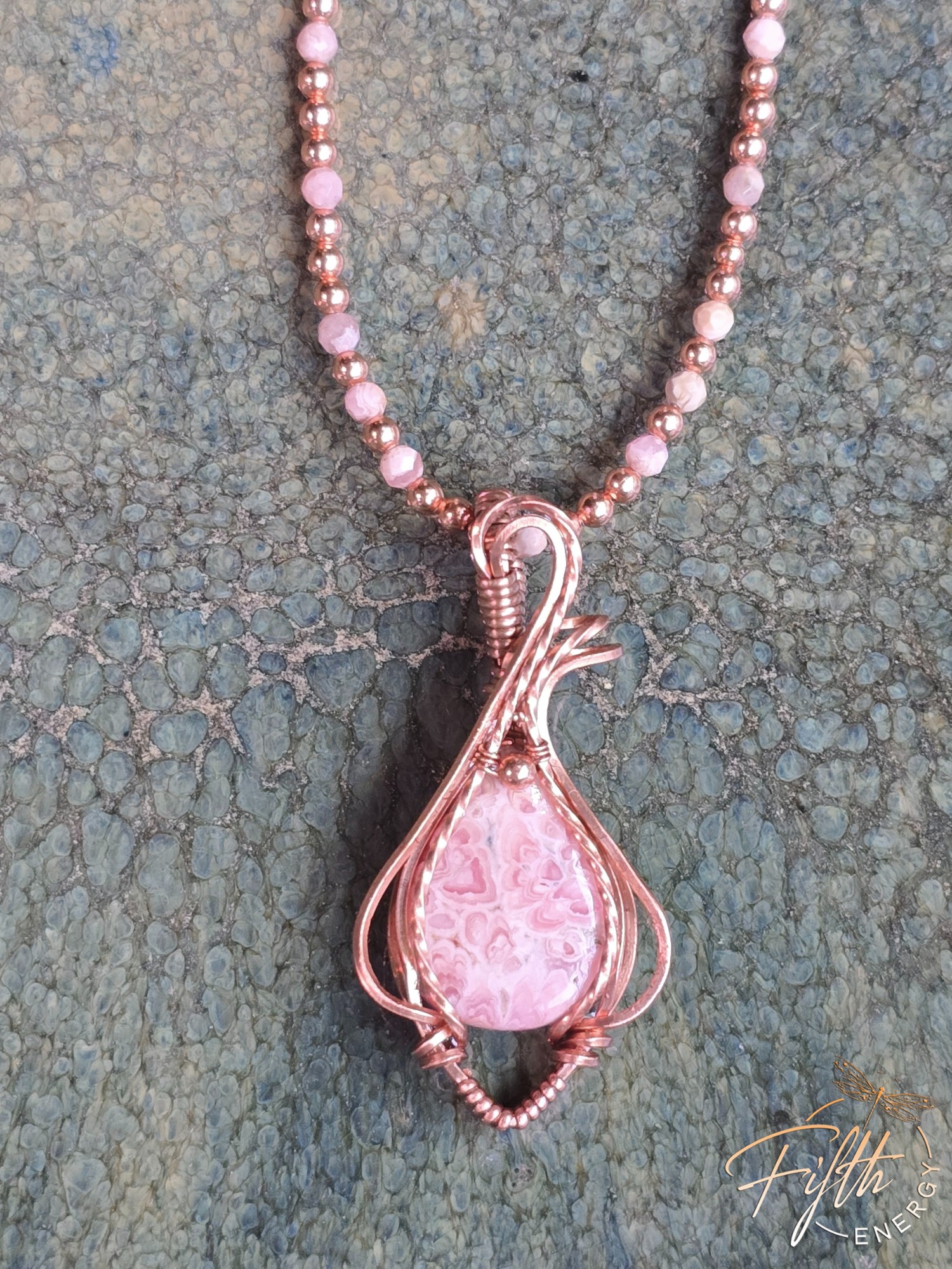 Beaded Rhodochrosite Necklace 4 Copper wire wrapped Rhodochrosite stone on a hand beaded Rhodochrosite and stainless steel cord