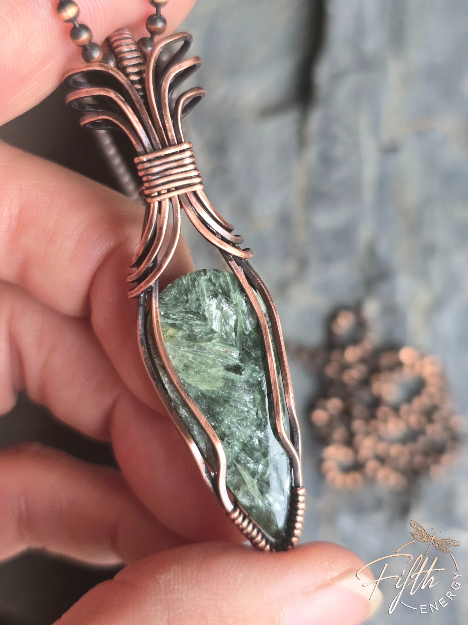 Seraphinite Necklace 3 Discover the Seraphinite Necklace by Fifth Energy Jewelry, featuring a shimmering deep green natural gemstone wrapped in handcrafted copper.