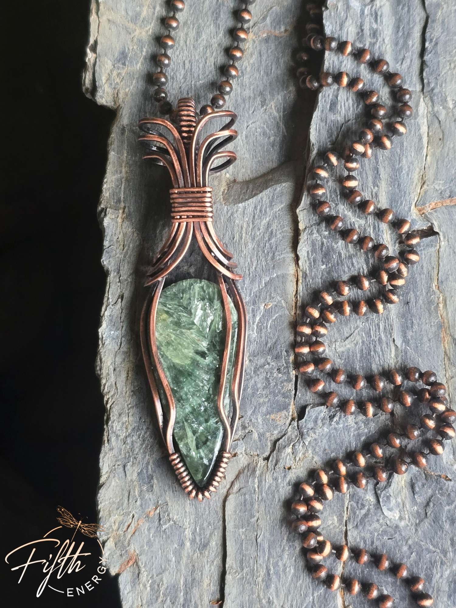Seraphinite Necklace 4 Discover the Seraphinite Necklace by Fifth Energy Jewelry, featuring a shimmering deep green natural gemstone wrapped in handcrafted copper.
