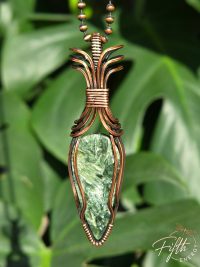Elevate your look with a Seraphinite Necklace from Fifth Energy Jewelry, glowing with deep green shimmer and handcrafted copper artistry.