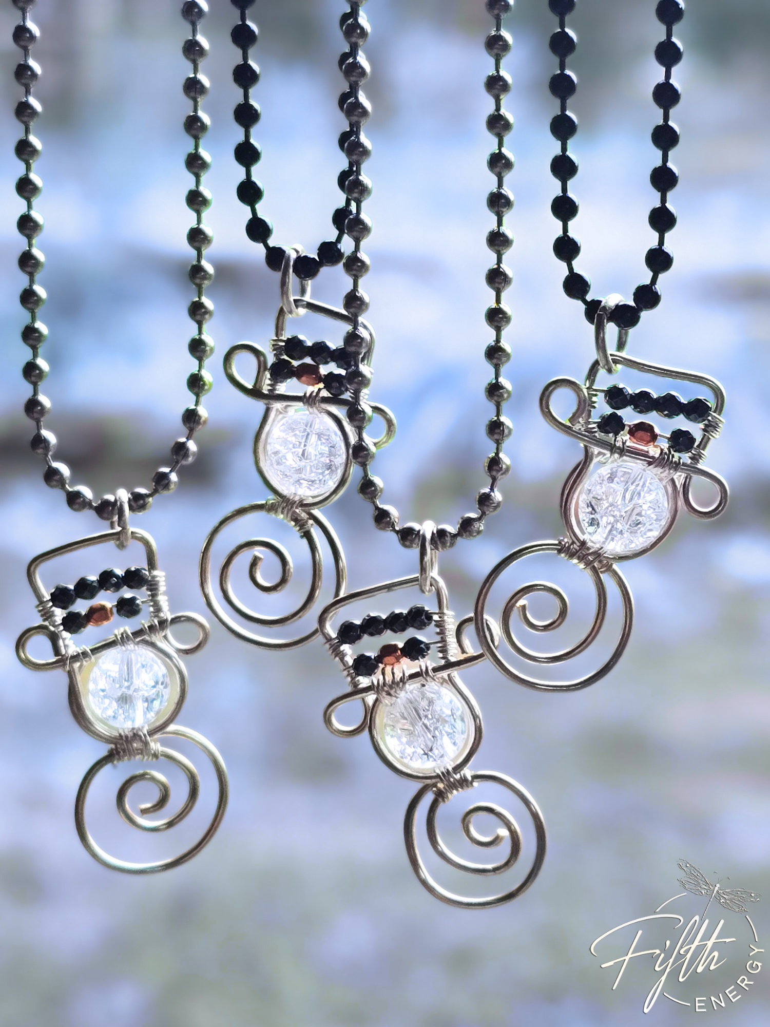 Crackled Quartz Snowman Necklace | Winter Jewelry Gift 3 Close-up of a crackled quartz snowman pendant featuring natural hematite gemstones and dual ball chain options.